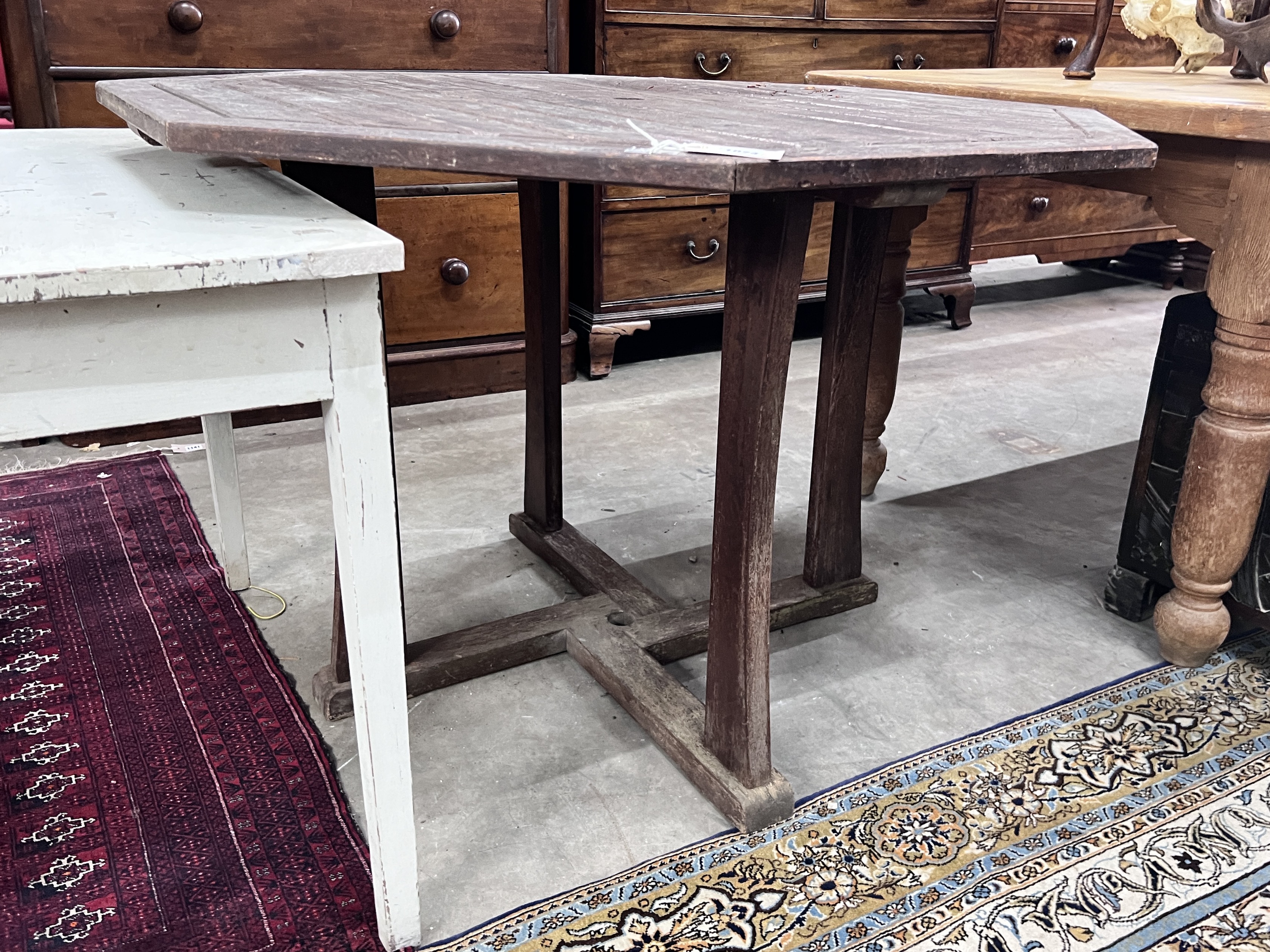 An octagonal teak garden table, width 111cm, height 75cm